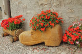 handmade wooden planters for flowering plants on country backyar