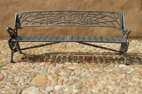 Vintage metal bench on paved sidewalk, Spain, Europe — Stock Photo, Image