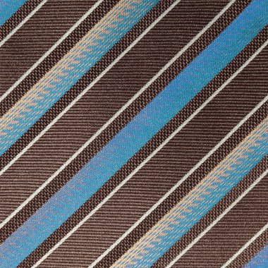 fabric with diagonal various widths blue , black and white stri clipart