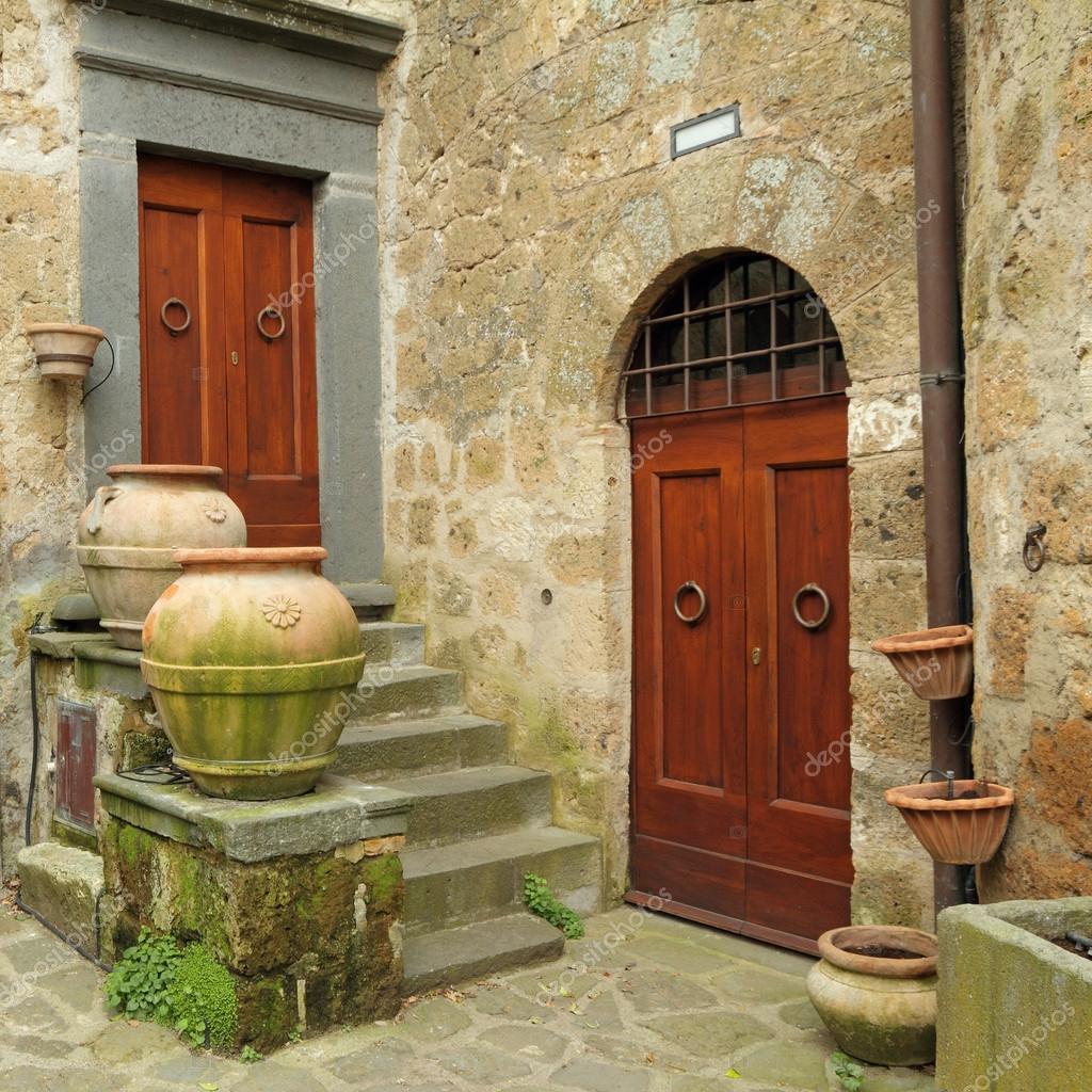 Two antique doors in italian village Civita di Bagnoregio, provi — Stock  Photo © Malgorzata_Kistryn #29621055, image size:1024x1024