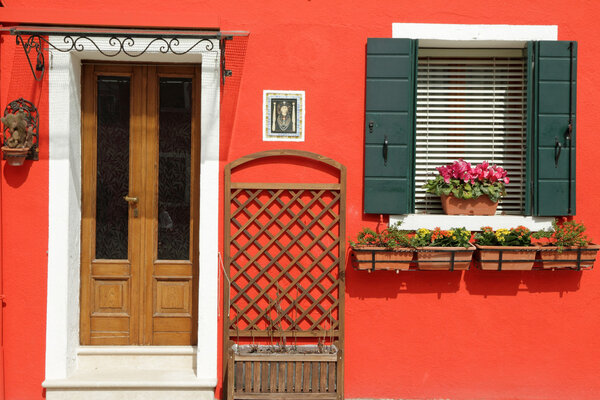 entrance to the typical vivid painted house on Burano island, Ve