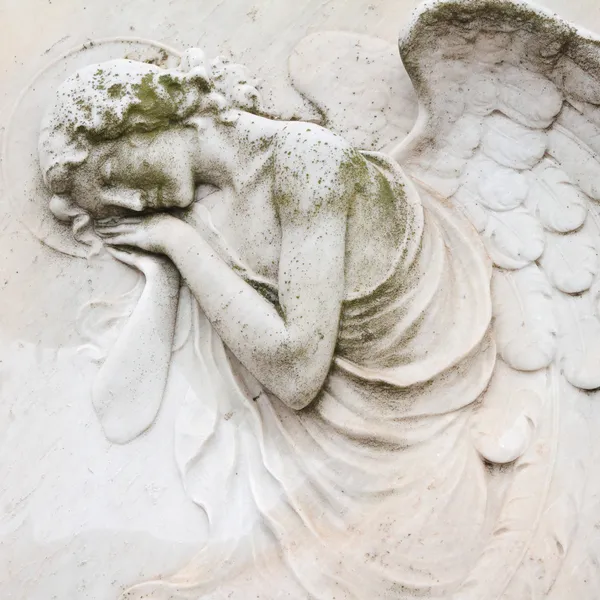 Sleeping angel - antique decoration on tombstone, monumental cem — Stock Photo, Image