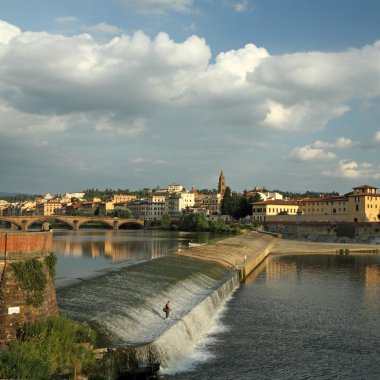 Arno river with the Pescaia di Santa Rosa and Oltrarno clipart