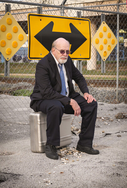 Which Way to Go? Old Businessman Ponders Uncertain Future