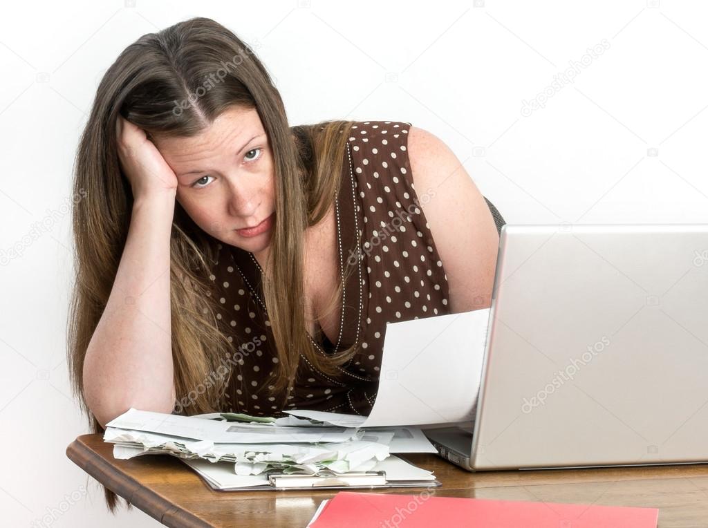 Cute Woman Paying Bills and Worrying About Making Ends Meet