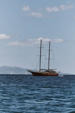 view of wooden ship or vessel in the coast of cagliari shoreline - poetto beach