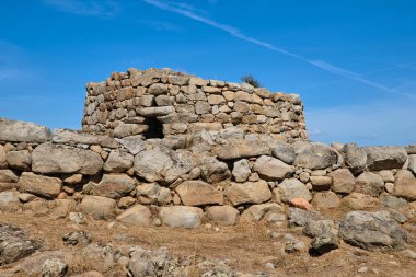 Great archaeological complex with Nuraghe di S'Ortali 'e Su Monti, village