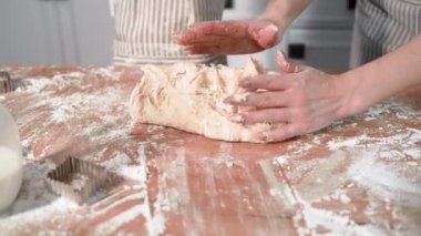 homemade pastries, loving mom and daughter have fun together making wheat flour dough at home in kitchen