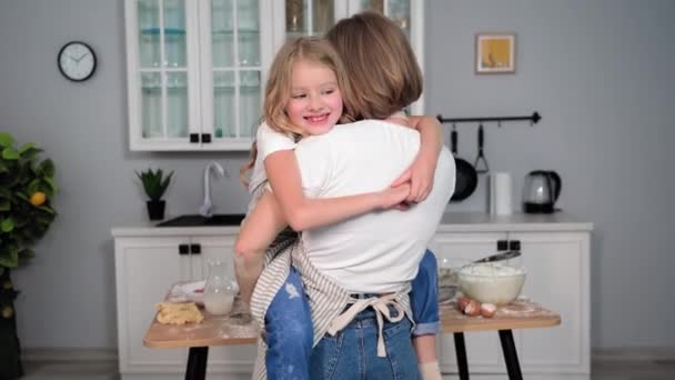 Girl Apron Has Fun Her Mother Arms Dances Backdrop Kitchen — Stock Video