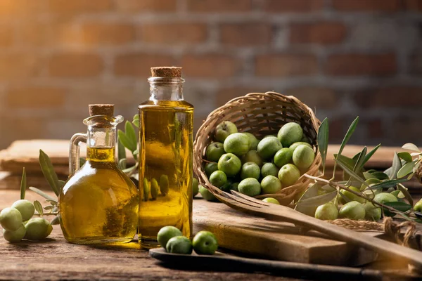 Olives and olive oil in a bottles close up