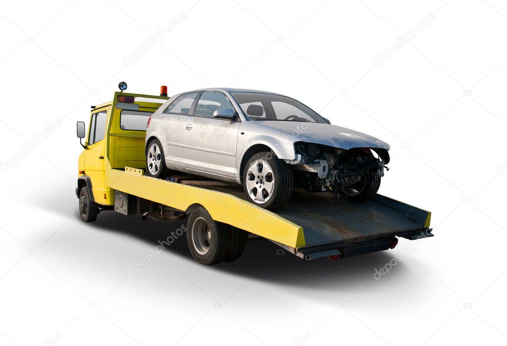 Damaged car after accident on tow truck isolated on white background