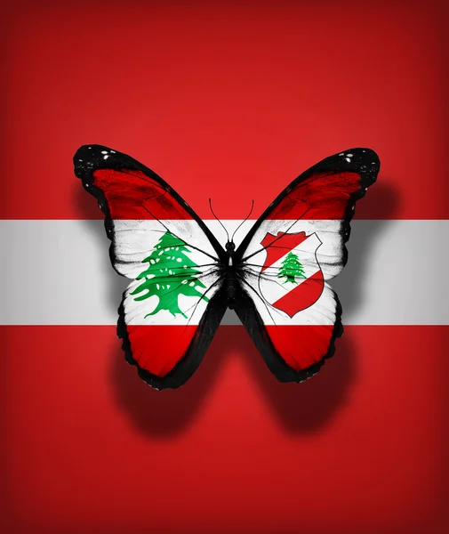 Ливанский флаг бабочка с эмблемой, изолированные на фоне флага — стоковое фото