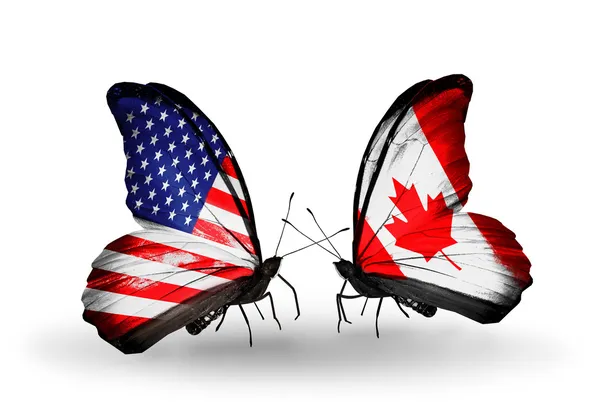2 つの蝶の翼上のフラグとの関係の記号として米国およびカナダ — ストック写真