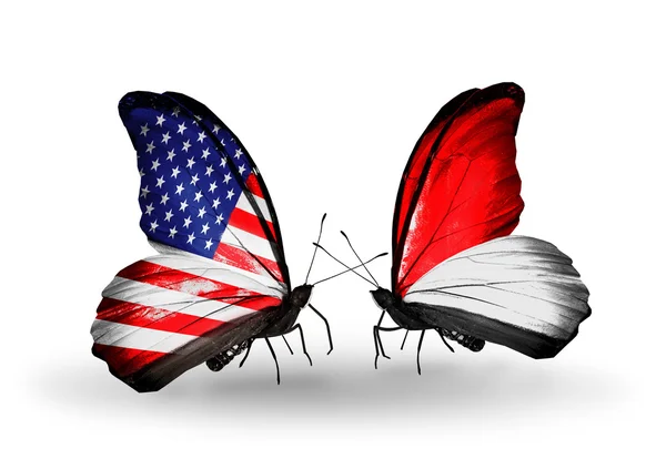 Two butterflies with flags on wings as symbol of relations USA and Indonesia or Monaco — Stock Photo, Image