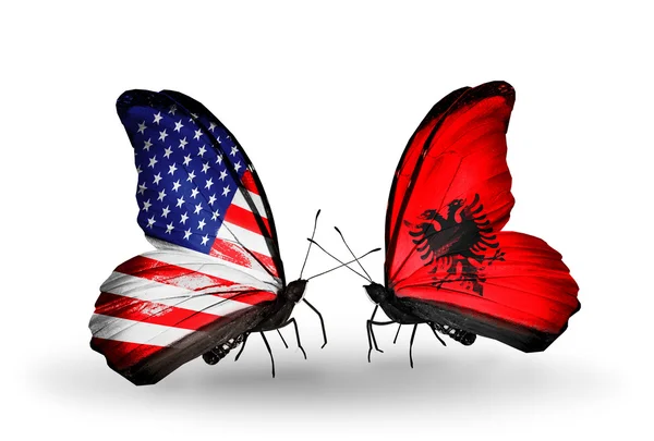 Two butterflies with flags on wings as symbol of relations USA and Albania — Stock Photo, Image