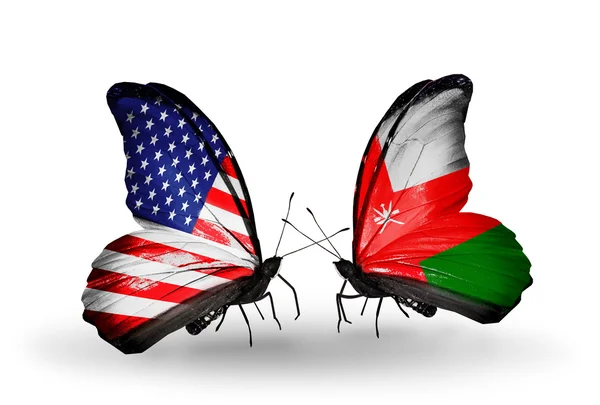 Two butterflies with flags on wings as symbol of relations USA and Oman — Stock Photo, Image