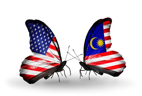 Two butterflies with flags on wings as symbol of relations USA and Malaysia — Stock Photo, Image