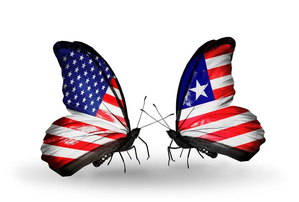 Duas borboletas com bandeiras em asas como símbolo de relações EUA e Libéria — Fotografia de Stock