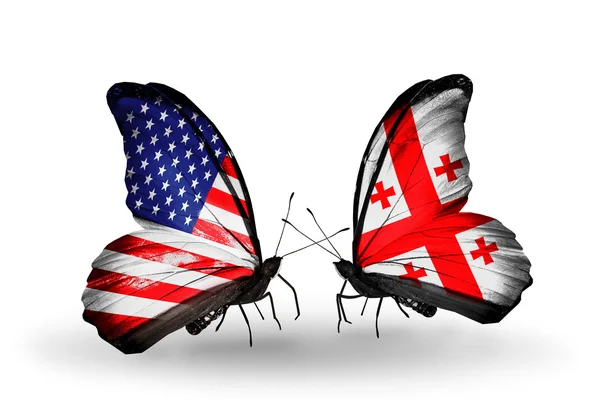 Two butterflies with flags on wings as symbol of relations USA and Georgia — Stock Photo, Image
