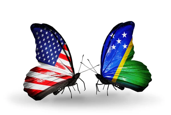 Two butterflies with flags on wings as symbol of relations USA and Solomon Islands — Stock Photo, Image