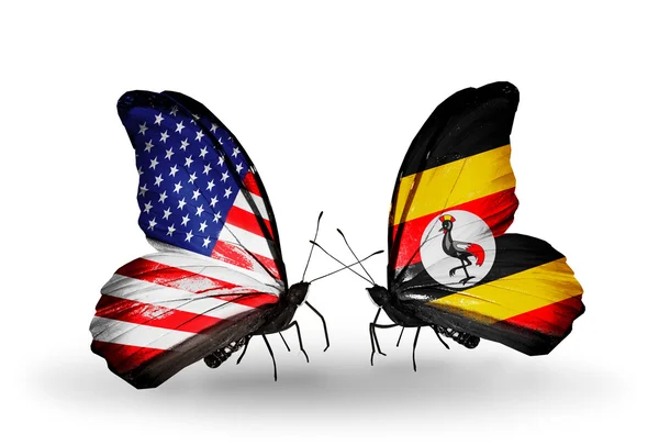 Две бабочки с флагами на крыльях как символ отношений США и Уганды — стоковое фото