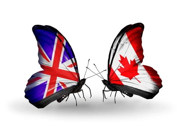 Dwa motyle z flagami na skrzydłach jako symbol stosunków, Wielkiej Brytanii i Kanada — Zdjęcie stockowe