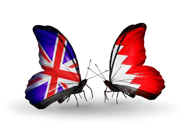 Two butterflies with flags on wings as symbol of relations UK and Bahrain — Stock Photo, Image