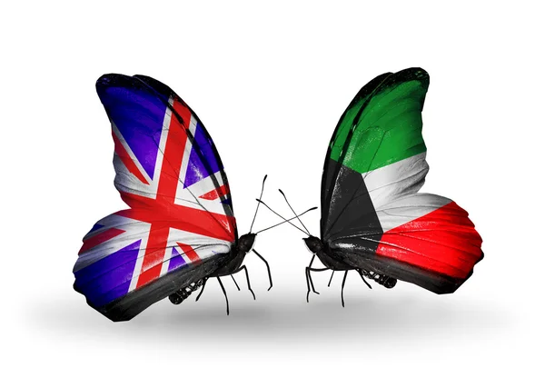 两个蝴蝶翅膀上的标志与象征的关系作为英国和科威特 — 图库照片