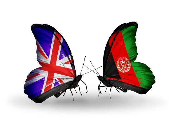 Dos mariposas con banderas en las alas como símbolo de relaciones Reino Unido y Afganistán —  Fotos de Stock