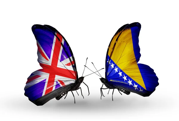 Dos mariposas con banderas en alas como símbolo de las relaciones Reino Unido y Bosnia y Herzegovina —  Fotos de Stock