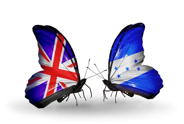 Two butterflies with flags on wings as symbol of relations UK and Honduras — Stock Photo, Image