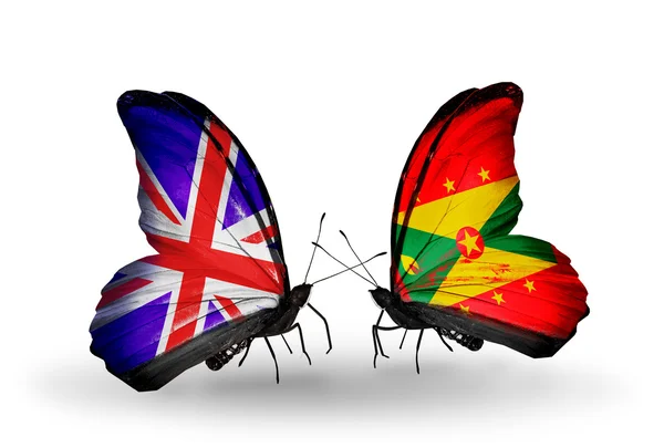 Две бабочки с флагами на крыльях как символ отношений Великобритании и Гренады — стоковое фото