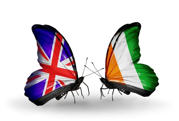 Two butterflies with flags on wings as symbol of relations UK and Cote Divoire — Stock Photo, Image