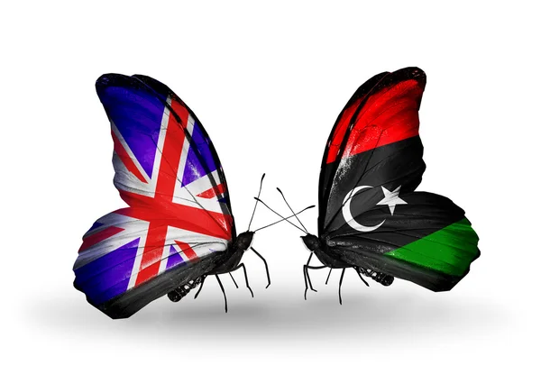 Dwa motyle z flagami na skrzydłach jako symbol stosunków, Wielkiej Brytanii i Libii — Zdjęcie stockowe