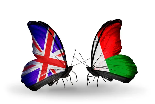 Two butterflies with flags on wings as symbol of relations UK and Madagascar — Stock Photo, Image