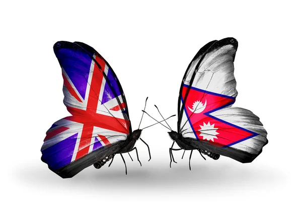 Zwei Schmetterlinge mit Flaggen auf Flügeln als Symbol der Beziehungen uk und nepal — Stockfoto