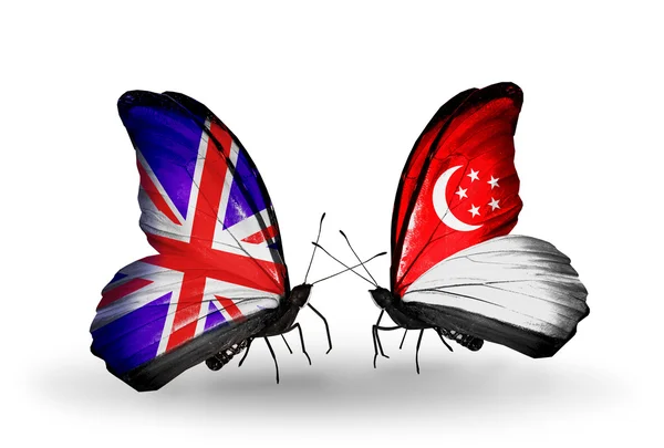 Two butterflies with flags on wings as symbol of relations UK and Singapore — Stock Photo, Image