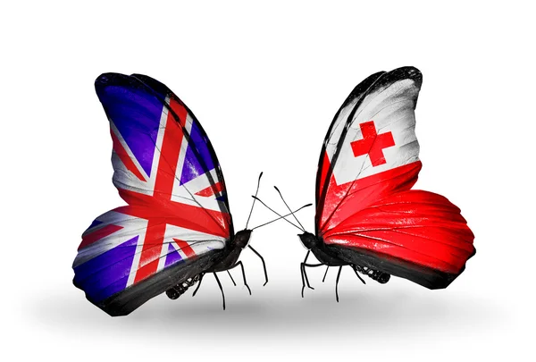 Dos mariposas con banderas en alas como símbolo de relaciones Reino Unido y Tonga —  Fotos de Stock