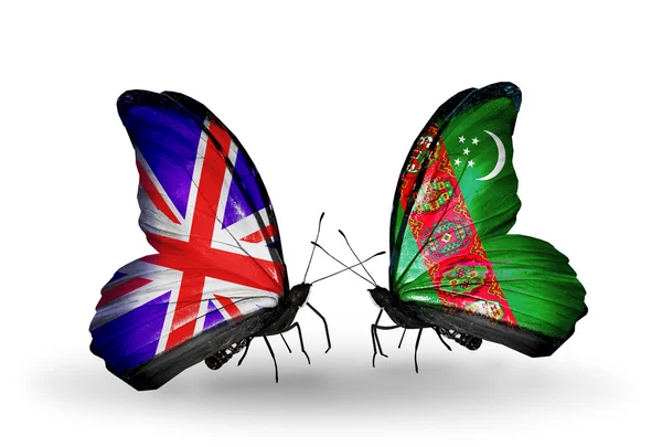 Two butterflies with flags on wings as symbol of relations UK and Turkmenistan — Stock Photo, Image