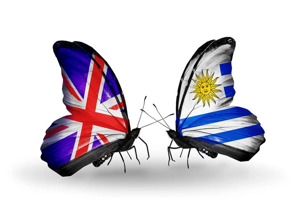 Two butterflies with flags on wings as symbol of relations UK and Uruguay — Stock Photo, Image