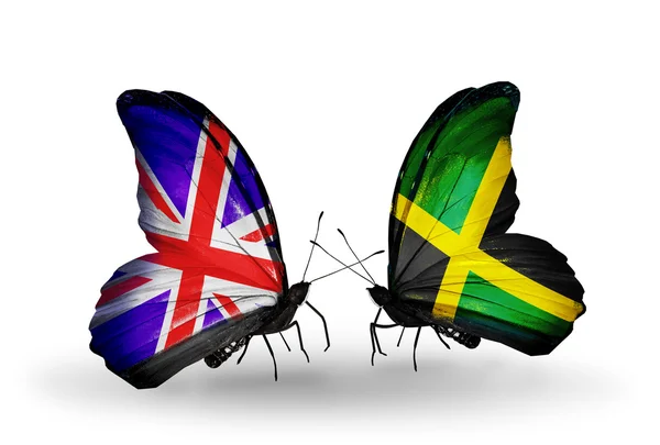 Dos mariposas con banderas en alas como símbolo de relaciones Reino Unido y Jamaica — Foto de Stock