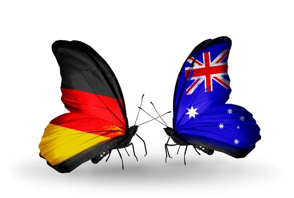 ผีเสื้อสองตัวที่มีธงบนปีกเป็นสัญลักษณ์ของความสัมพันธ์ระหว่างเยอรมนีและออสเตรเลีย — ภาพถ่ายสต็อก