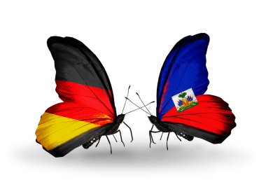 İki kanat bayrakları ile ilişkileri sembolü olarak Almanya ve haiti kelebekler