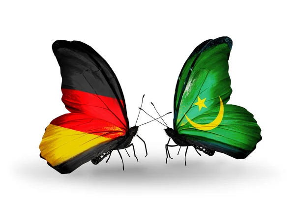 2 つの蝶の翼上のフラグとの関係の記号としてドイツそしてモーリタニア — ストック写真