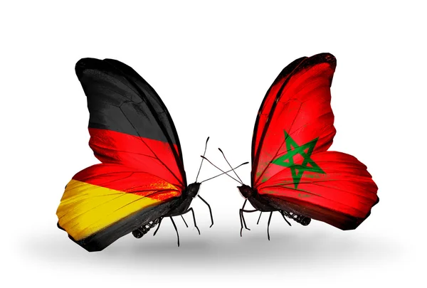 Zwei Schmetterlinge mit Flügelfahnen als Symbol der Beziehungen zwischen Deutschland und Marokko — Stockfoto