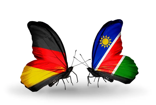 Two butterflies with flags on wings as symbol of relations Germany and Namibia — Stock Photo, Image