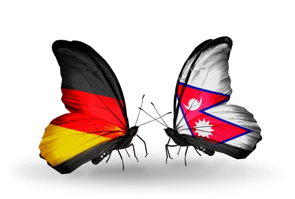 Zwei Schmetterlinge mit Flügelfahnen als Symbol der Beziehungen zwischen Deutschland und Nepal — Stockfoto