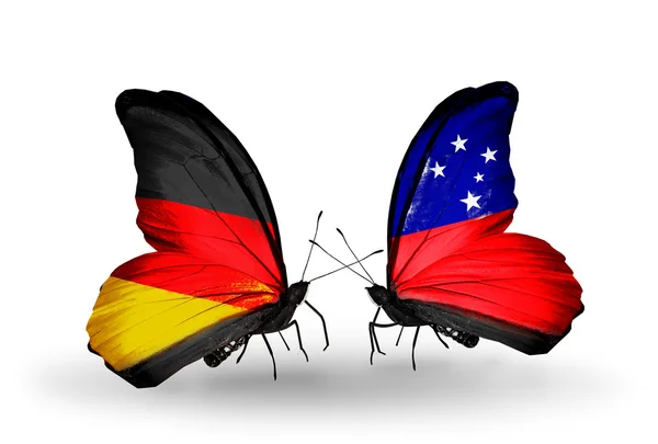 İki kanat bayrakları ile ilişkileri sembolü olarak Almanya ve samoa kelebekler — Stok fotoğraf