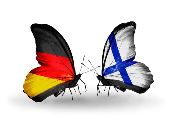 Two butterflies with flags on wings as symbol of relations Germany and Finland — Stock Photo, Image