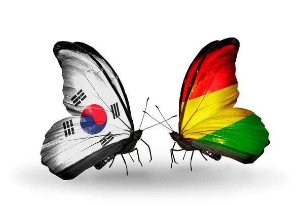 Dos mariposas con banderas en alas como símbolo de relaciones Corea del Sur y Benín —  Fotos de Stock